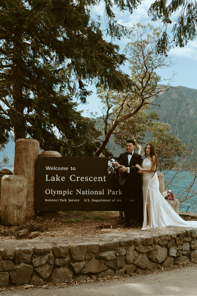 Champagne pop of a wedding couple at Lake Crescent