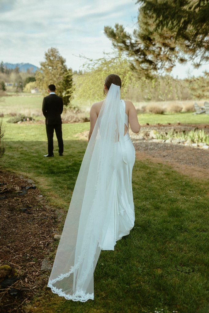 a bride talking towards her groom