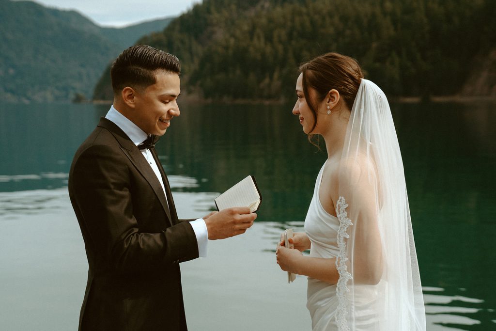 Groom readings his vows at Lake Crescent