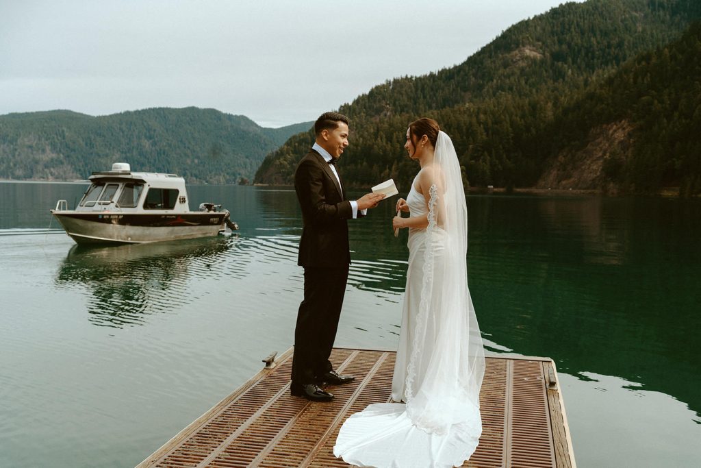 Groom readings his vows at Lake Crescent